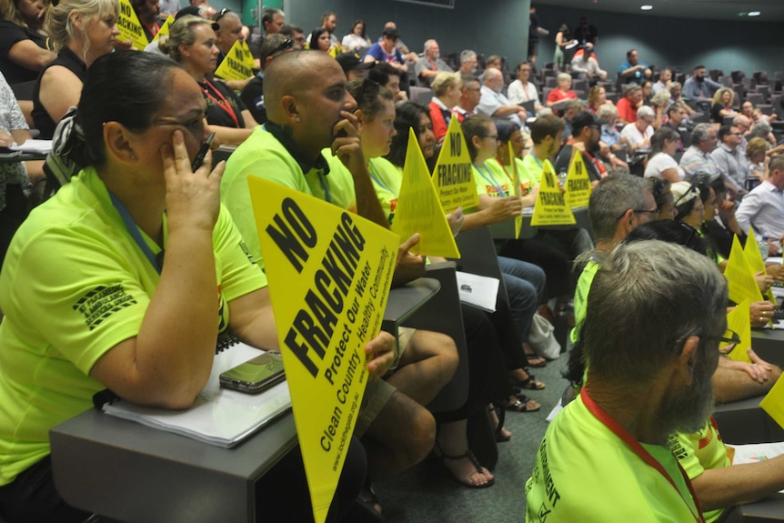 Union members hold up np fracking signs during Michael Gunner's speech.