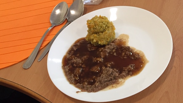 Green mash and brown mince in gravy.