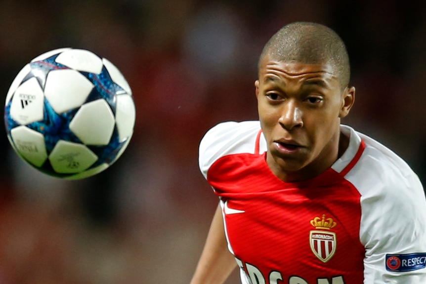 AS Monaco's Kylian Mbappe follows the ball against Borussia Dortmund.