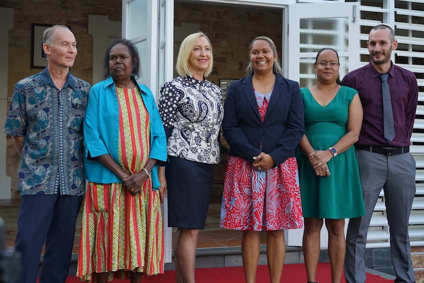 Selena Uibo stands with her family and the NT Administrator outside Government House.