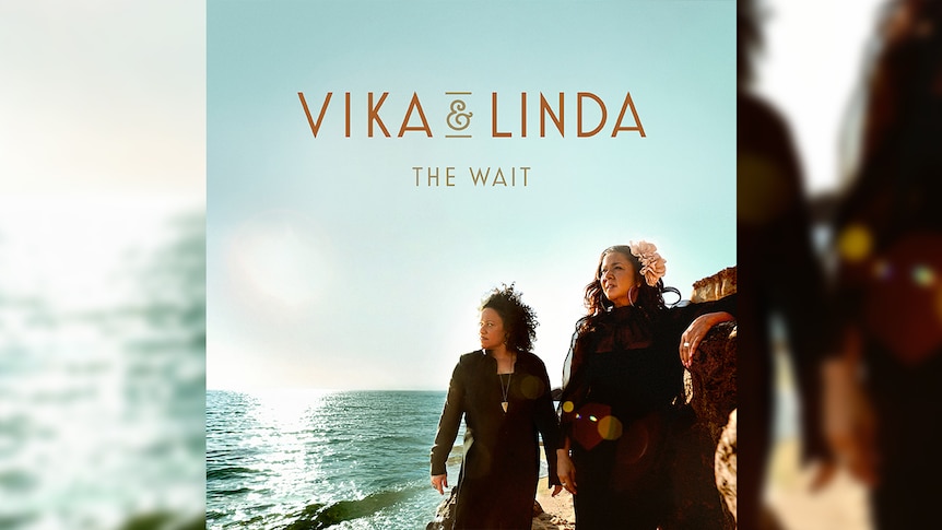 Vika and Linda Bull stand on the shore of the ocean on the cover of their album The Wait