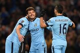 Manchester City's David Silva (C) celebrates with team-mates after scoring against Newcastle.