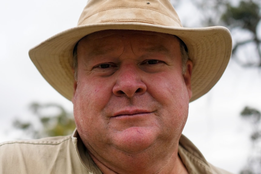 A close-up of Kojonup farmer Nick Trethowan's face. He is wearing a beige hat