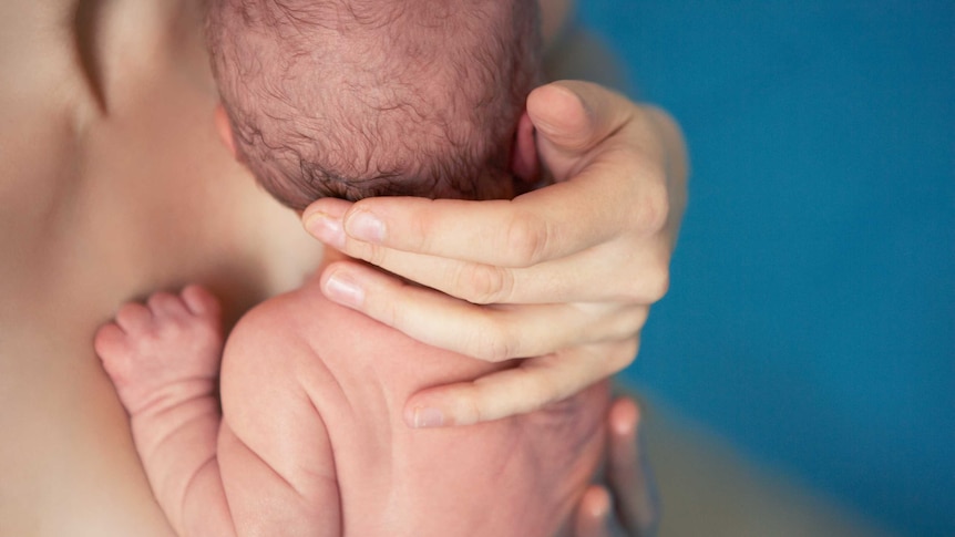 Newborn baby with birthing pool