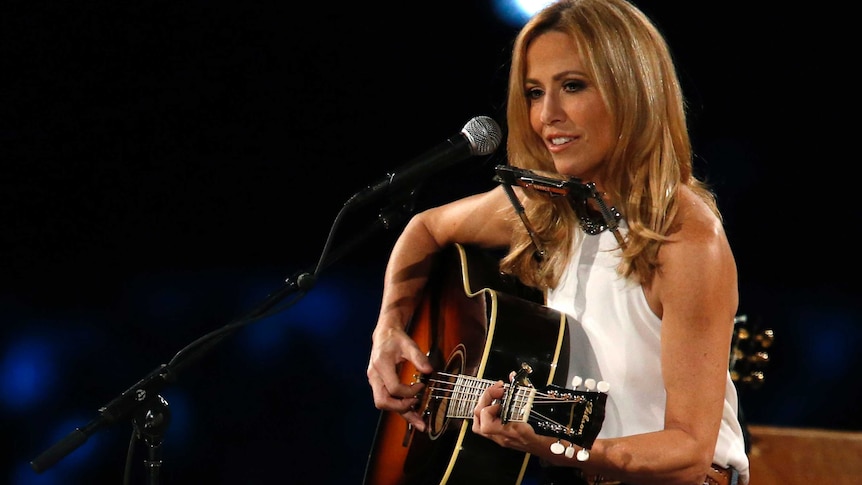 Sheryl Crow performing on stage