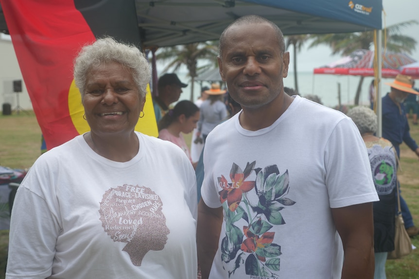 A woman on the left with short grey hair, wearing a white shirt, smiling, Lance to her right, white shirt, smiling.