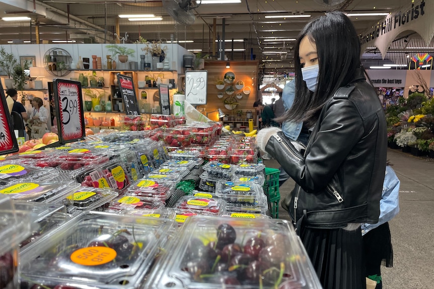 A person shopping at a market.