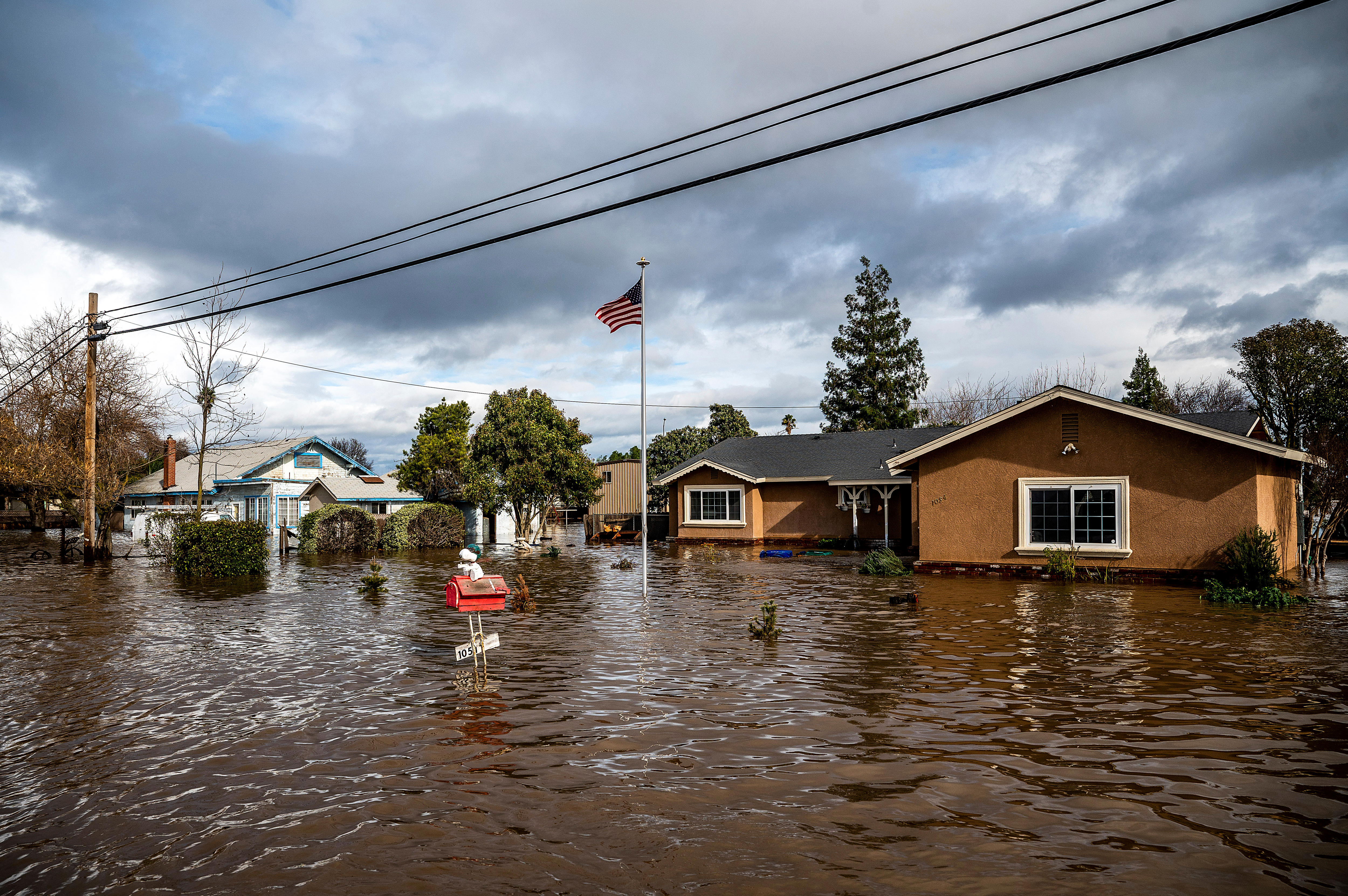 Houses up to the windows covered in flood water