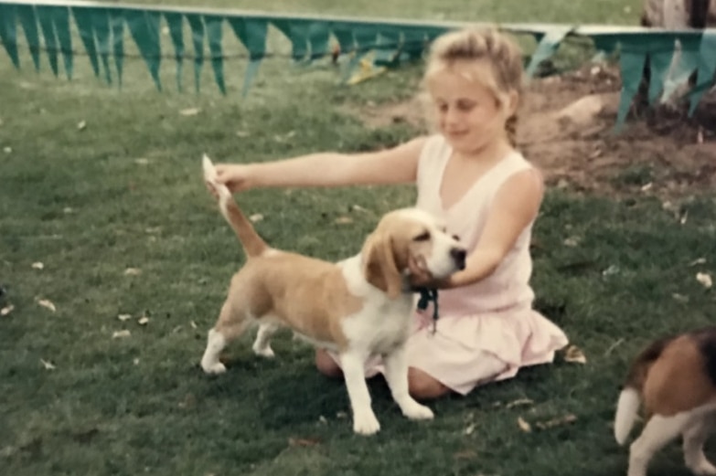 Rebel Wilson with a young beagle as a child.