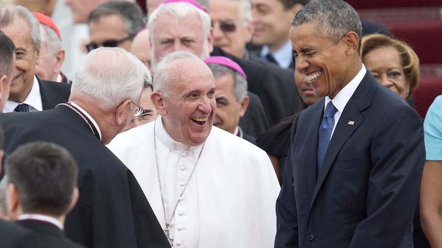 Pope Francis laughs with US President Barack Obama upon the Pope's arrival at Andrews Air Force Base.