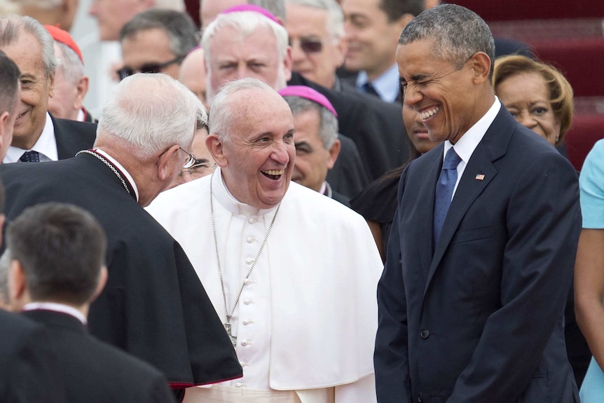 Pope Francis laughs with US President Barack Obama upon the Pope's arrival at Andrews Air Force Base.