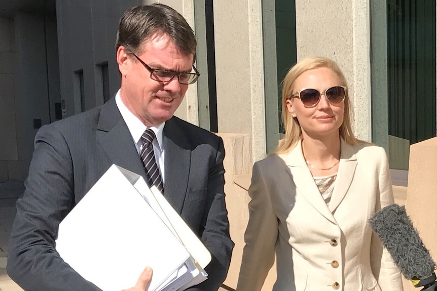 Clive Palmer's wife, Anna Palmer, outside the Federal Court in Brisbane with her lawyer, on February 16, 2017