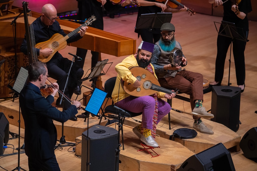 Joseph and James Tawadros perform on stage with Richard Tognetti and the Australian Chamber Orchestra.