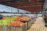 rows of fresh fruit inside supermarket