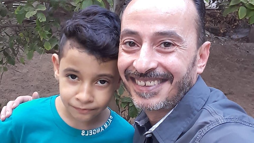 Hazem Sabawi with his son Kareem in Gaza.