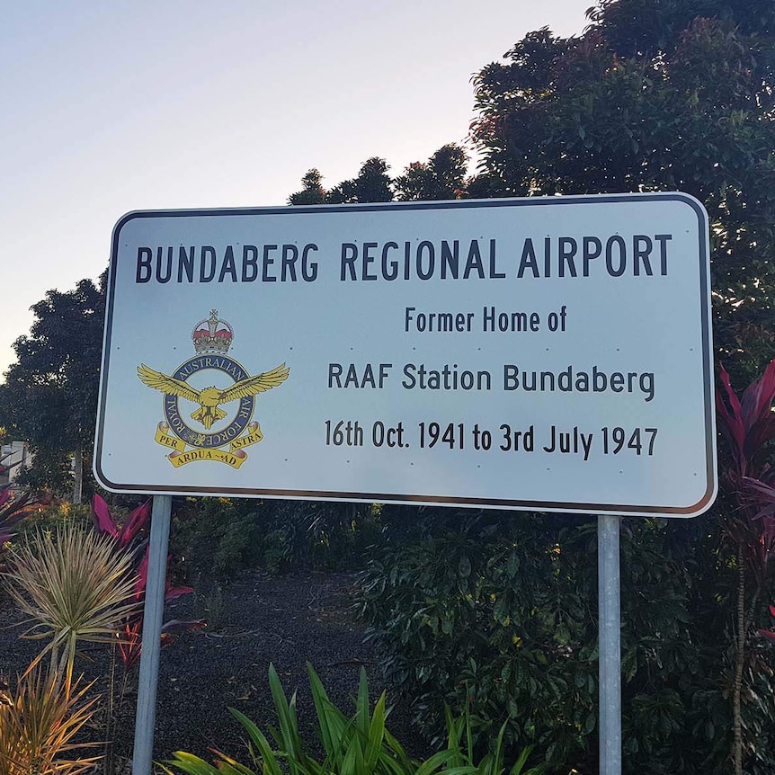 A sign saying Bundaberg Airport is the former home of a RAAF station