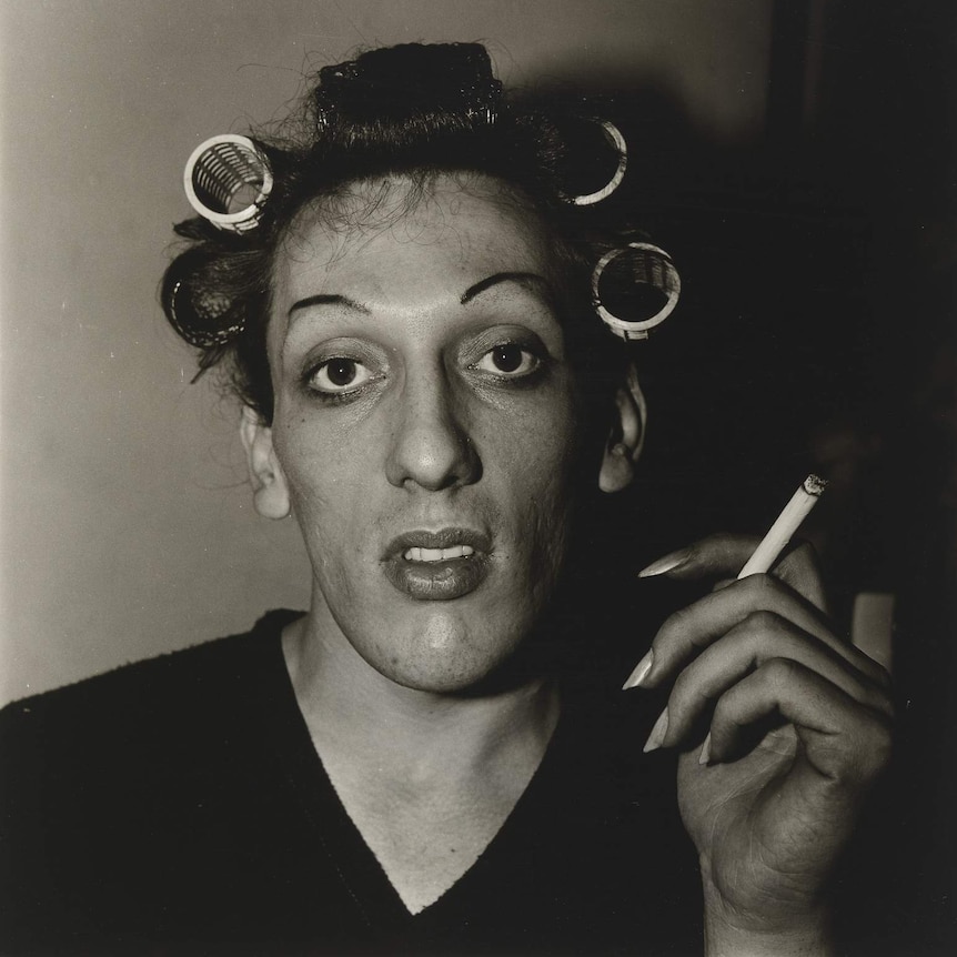 A young man in curlers at home on West 20th St., N.Y.C. 1966 by Diane Arbus
