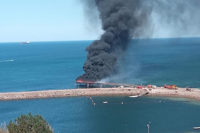 Black smoke rising above a jetty in Whyalla