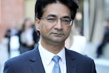 A tight head and shoulders shot of lloyd Rayney wearing a blue suit.