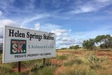 A sign for Helen Springs Station