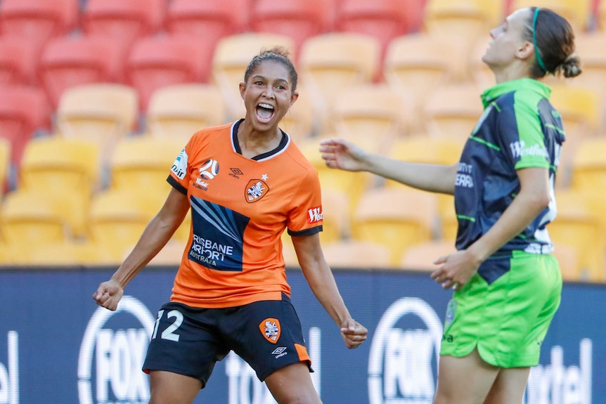 Allira Toby smiles as she celebrates scoring a goal for the Brisbane Roar against Canberra United in 2019.