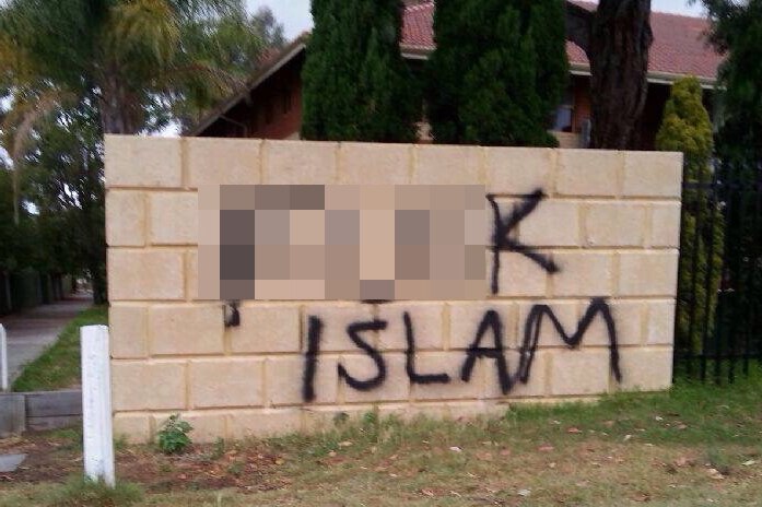 A wall outside a school/mosque has an anti-Islamic slur painted on it