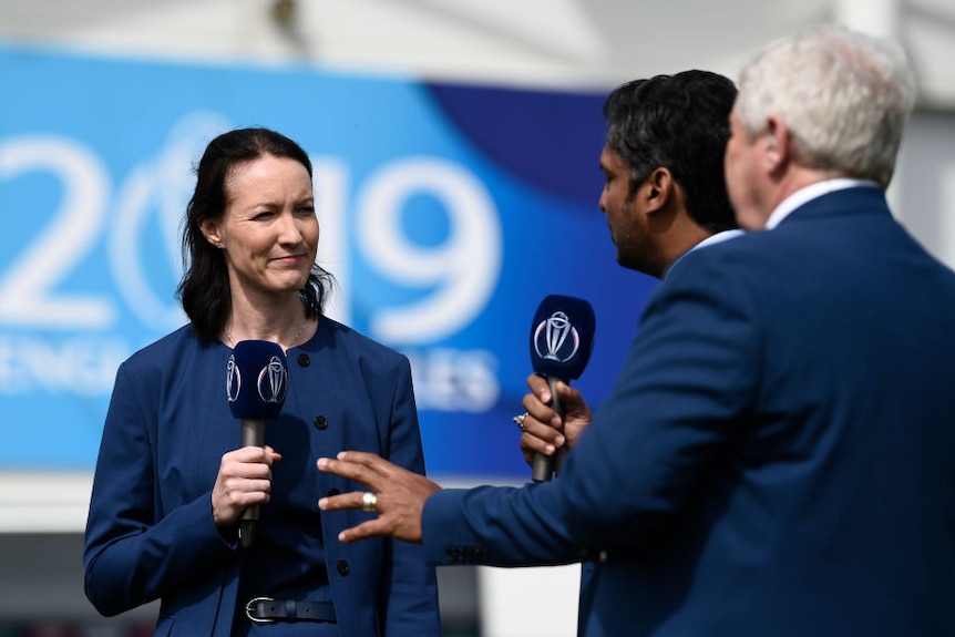 Commentator Alison Mitchell stands next to two male commentatorsat the Group Stage match of the ICC Cricket World Cup 2019.