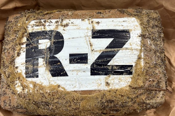 A dirty package with letters R-Z on it 