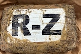 A dirty package with letters R-Z on it 