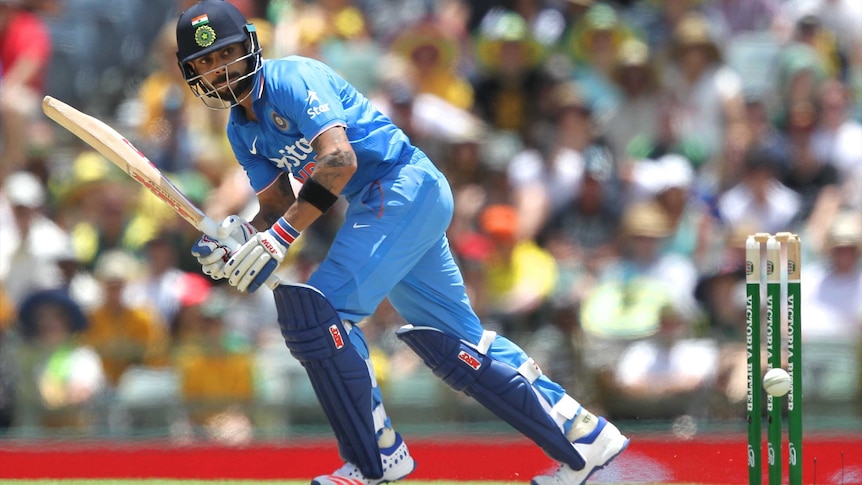 Virat Kohli batting a cricket ball on a pitch at the WACA