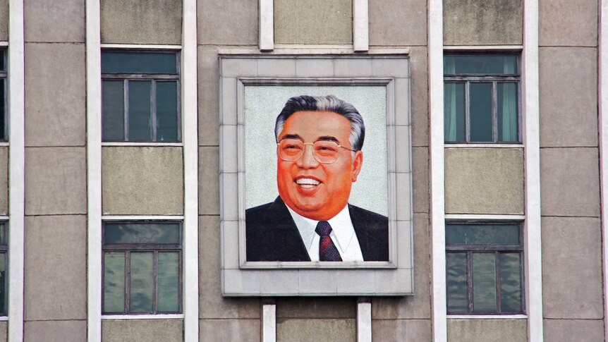 A portrait of Kim Il Sung.