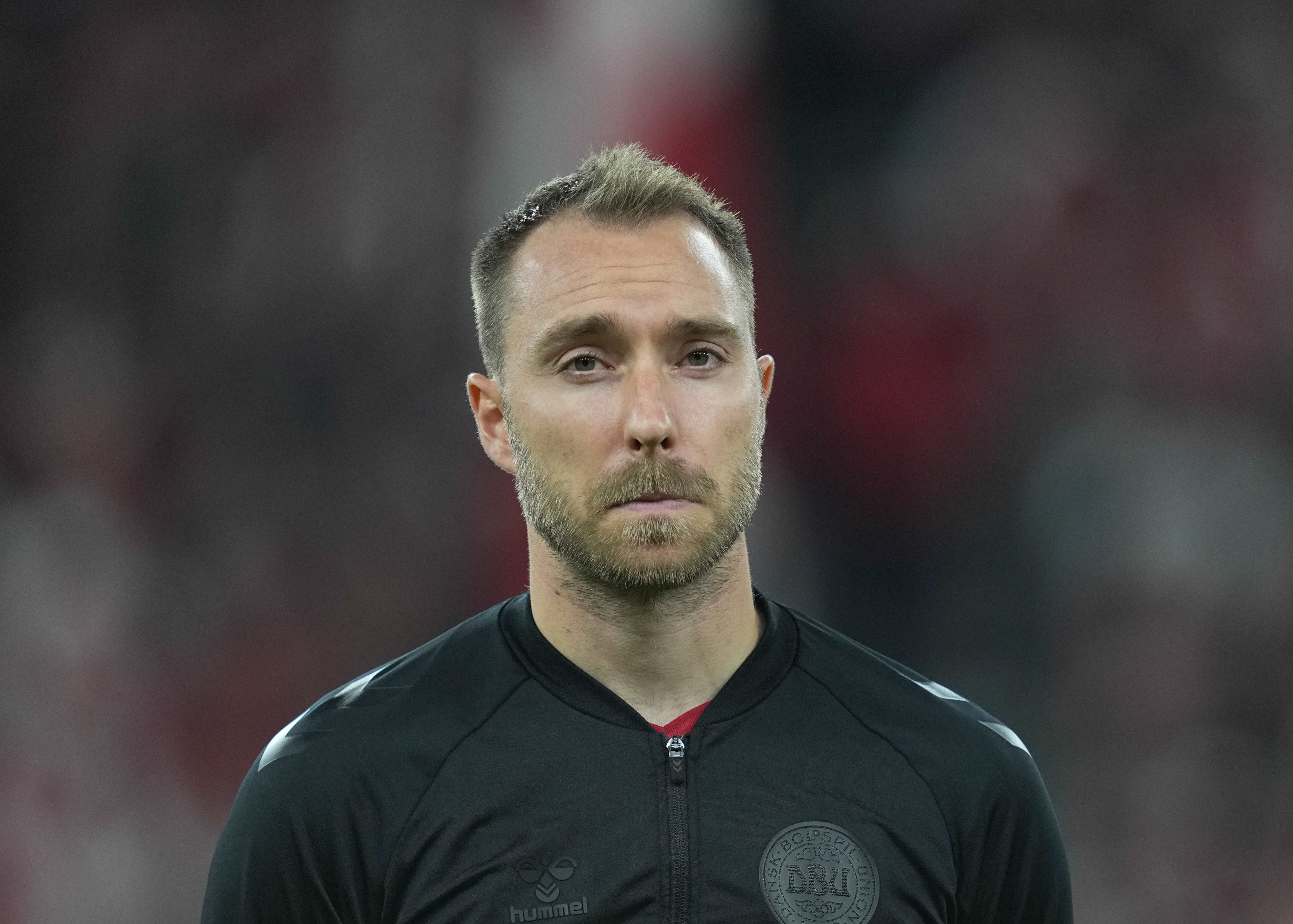 Christian Eriksen in black warm up kit