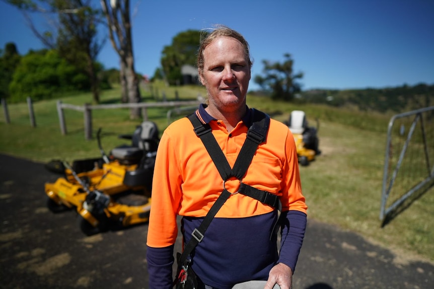 Byron Bay landscaper Brad Reed in a high-visibility shirt.