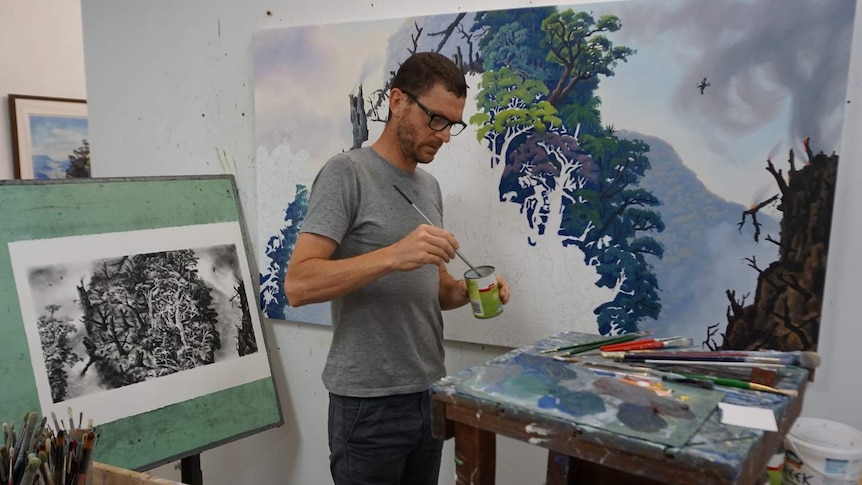 Man painting artworks of landscapes