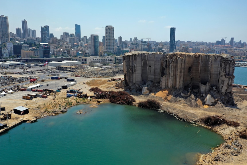 Drone footage a year after the explosion shows Beirut port and the buildings beside it in a state of crumbling disrepair