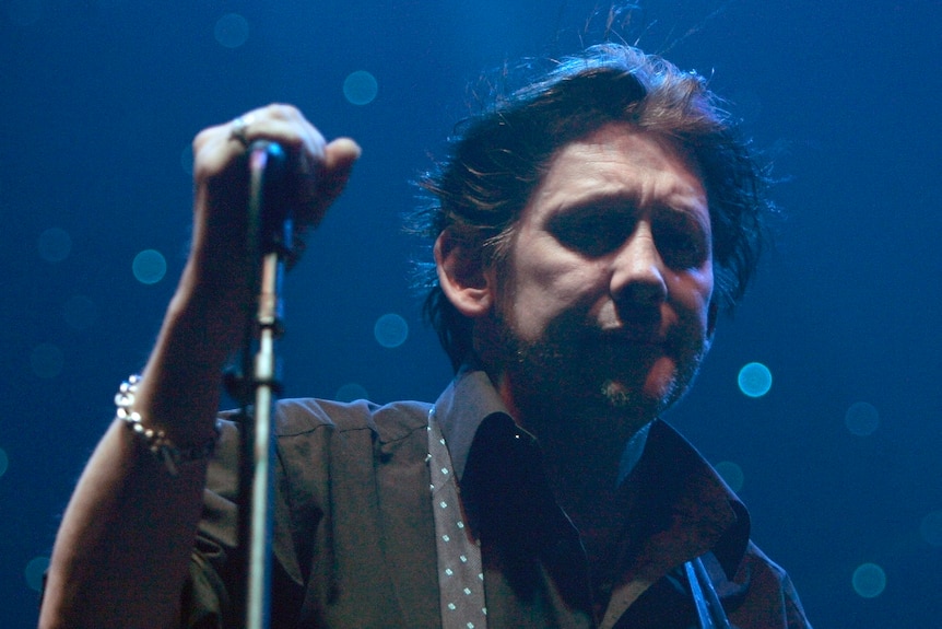 Lead vocalist Shane MacGowan of the Irish Celtic band The Pogues performs.
