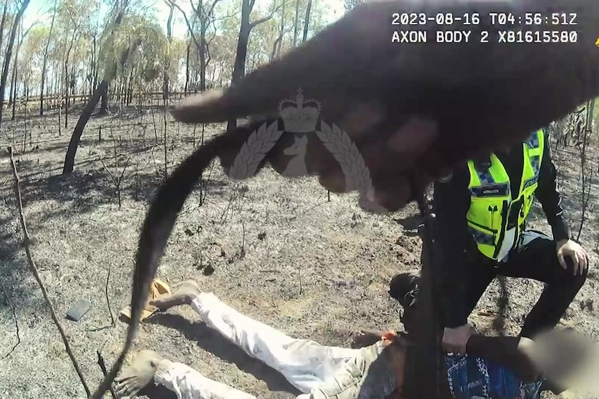 A thumbnail from a video of police arresting an Indigenous teenager in burnt out forest.