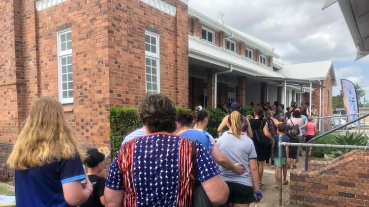 Families line up outside Centacare central Queensland