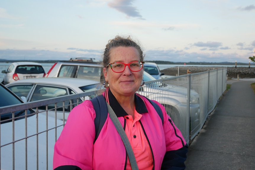 A woman in pink hi-vis.