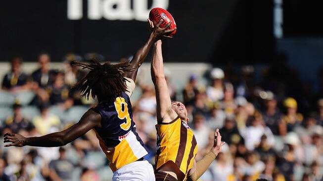 Flying high: Eagles ruckman Nic Naitanui (23 hit-outs) contests the ball against Brent Renouf.