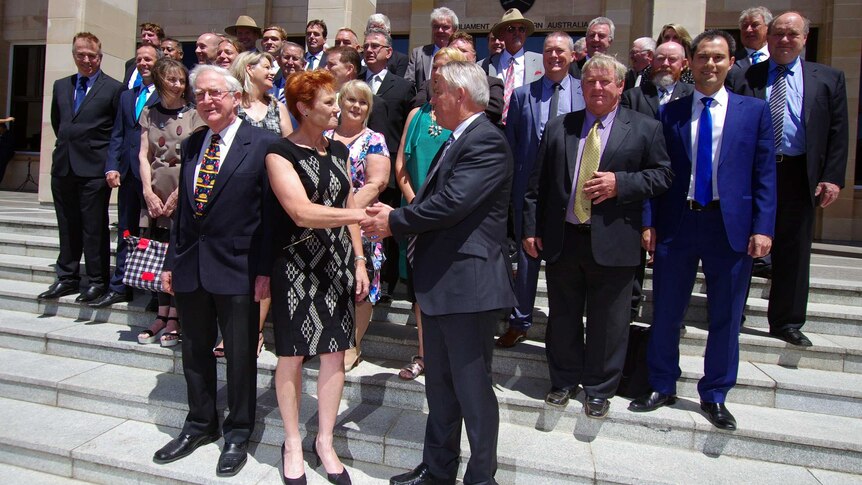 Pauline Hanson shakes WA party leader Colin Tincknell's hand