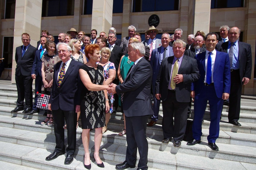 Pauline Hanson shakes WA party leader Colin Tincknell's hand