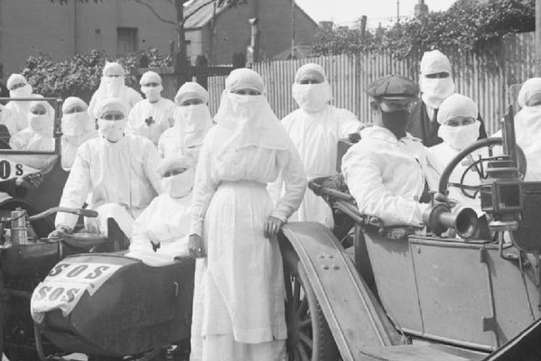 A team of doctors and nurses in 1919 pose with quarantine masks on outside Parramatta.