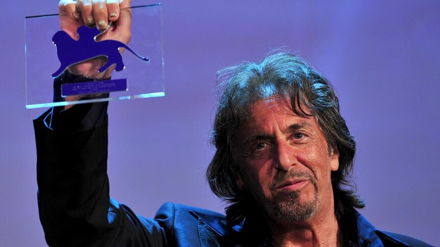 Al Pacino holds the Glory to the Film-maker Award he received at the Venice International Film Festival