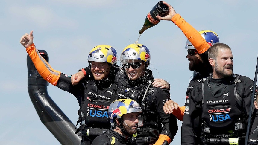 The champagne flows after Oracle Team USA wins the final America's Cup race.