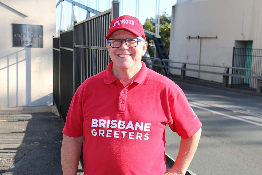 Blair Allsop standing in front of the Indooroopilly pylon.