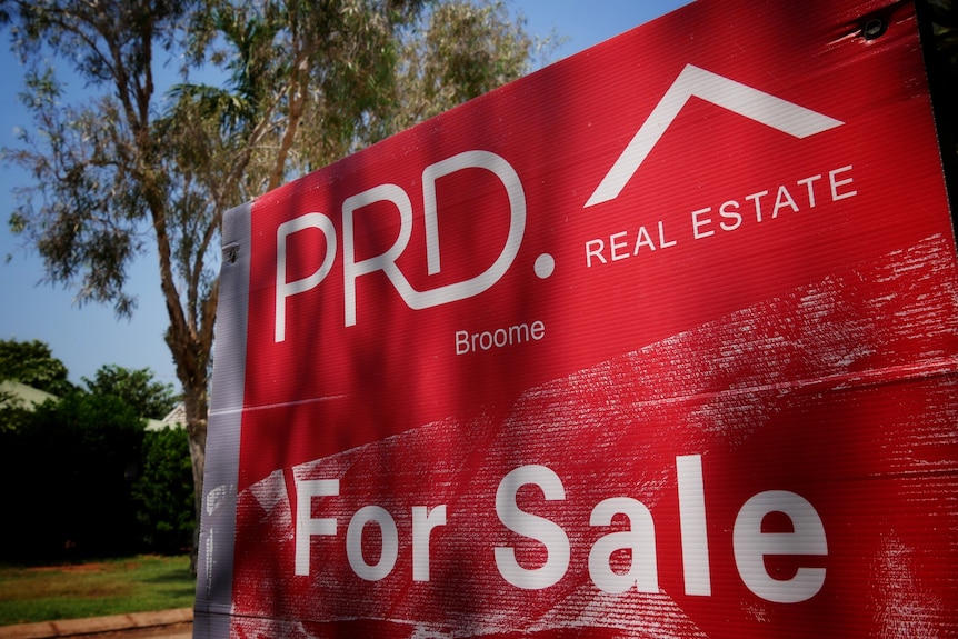 A close up image of a real estate sign in Broome 