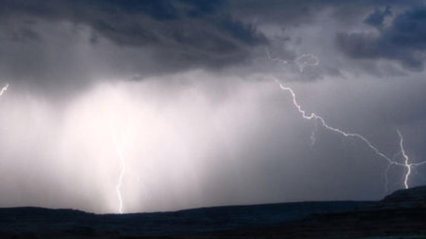 Dark storm clouds and lightning strikes in skies in south-east Queensland.