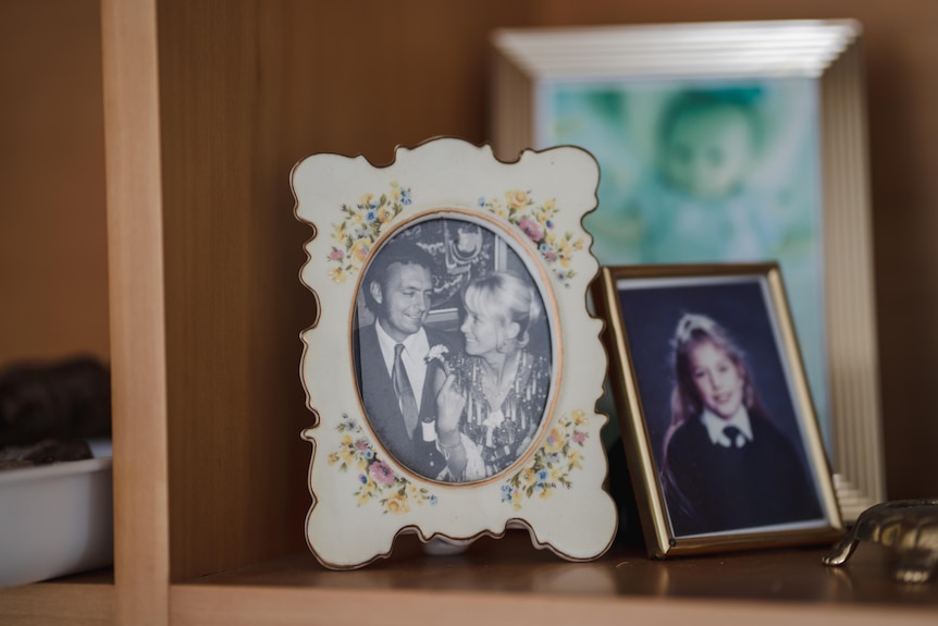 A black and white photo of a happy couple in a photo frame 