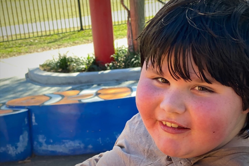 Smiling photo of eight-year-old Harrison Williams, who has muscular dystrophy.